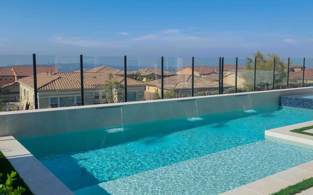 Pool with sheer descents and a glass view railing — NHG HOME project, Orange County