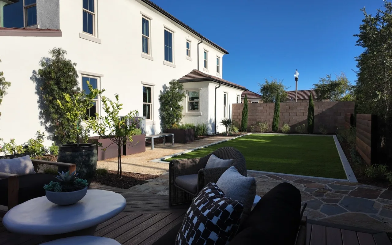 Backyard lounge with a deck, flagstone path and lawn — NHG HOME project, Orange County